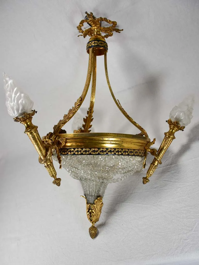 Early twentieth century torch chandelier with matching pair of wall sconces